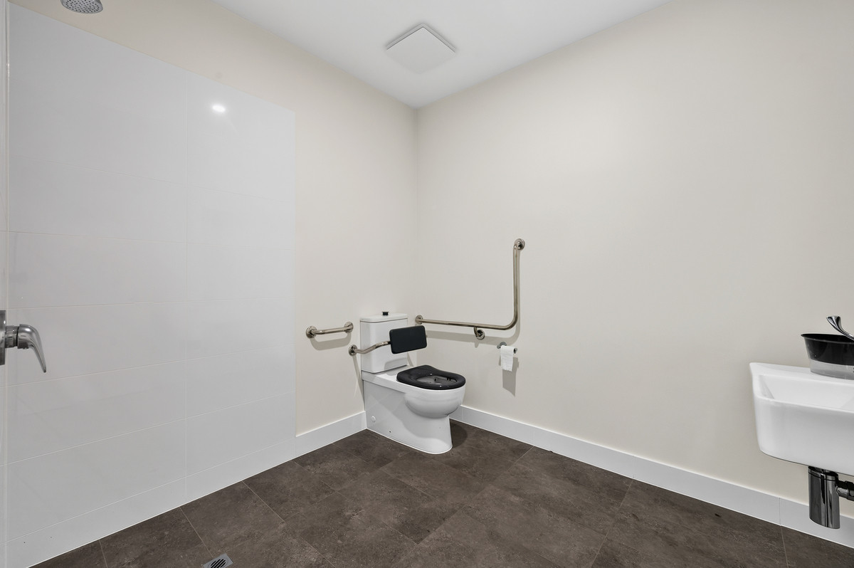 Toilet accommodating wheelchair access