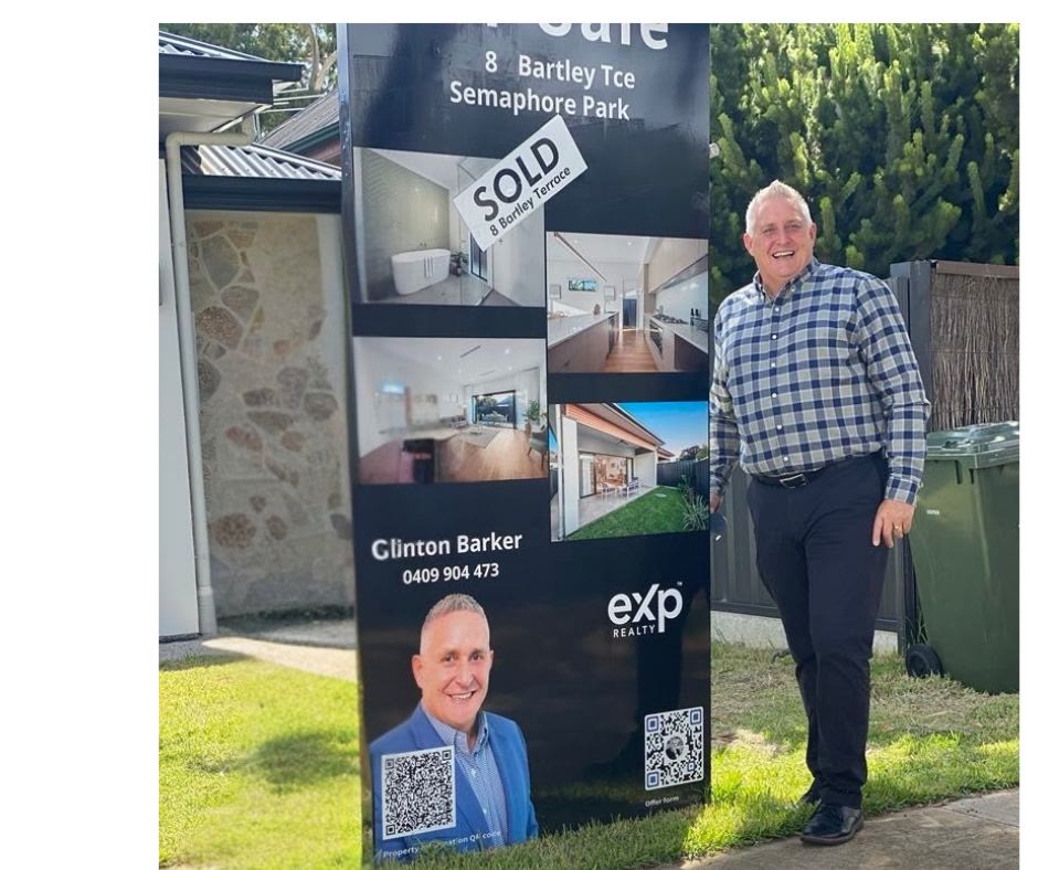 Clinton Barker with a sold sign at a completed northern Adelaide sale